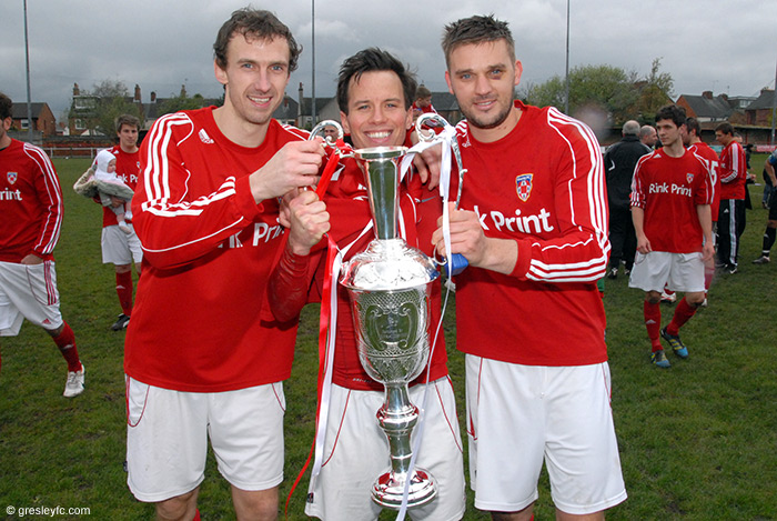 http://www.gresleyfc.com/images/matchphotos/6336/The-trophy-is-nearly-as-tall-as-Mickey-Lyons!.jpg