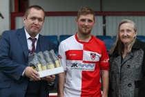 Kieran OConnell is presented with the man of the match award